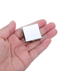 Hand holding a Glass Shelf Bracket Clip for 8-10mm Shelves, 4 Pack, Easy Install, Modern Minimalist Wall Mounts, sleek metal design