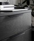 Installed 5 Pack No Drill Adhesive Edge Finger Pulls for cabinets in matte black on drawer, showcasing clean hidden handle design.
