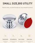 Two silver peel and stick cabinet knobs, 35mm coated plastic, great for renter friendly cupboard pulls, no drill needed.