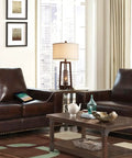 Living room with All In One 26 Inch Set Of 2 Farmhouse Table Lamps With USB And USB C Ports next to leather sofas.