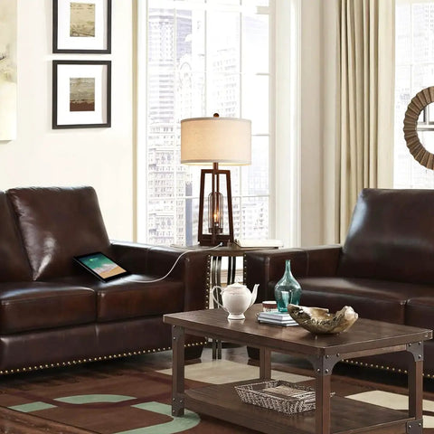 Living room with All In One 26 Inch Set Of 2 Farmhouse Table Lamps With USB And USB C Ports next to leather sofas.
