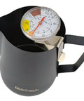 Milk Frothing Thermometer For Coffee And Chocolate Pro Grade Stainless Steel Temp Gauge clipped to black espresso pitcher