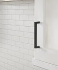 Monument Matte Black Cabinet Pull 5-1-16 Inch Center-To-Center installed on a kitchen cabinet, modern drawer handle, 5-7/16 Inch length