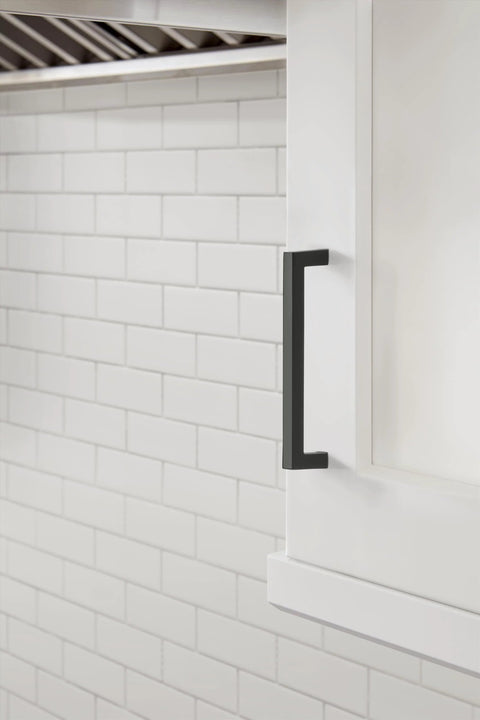Monument Matte Black Cabinet Pull 5-1-16 Inch Center-To-Center installed on a kitchen cabinet, modern drawer handle, 5-7/16 Inch length