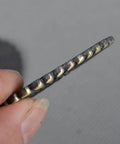 Close-up of the edge of a Two Piece Brass Seppa Spacer Set for Japanese Samurai swords replacement tsuba tightening fitting.