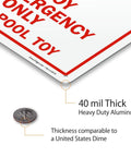 Close-up of the Ring Buoy Emergency Use Only Sign Not A Pool Toy 10 X 14 Aluminum Heavy Duty 40 Mil Rustproof with thickness comparison to a dime.