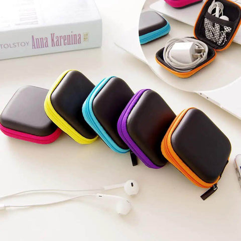 6 Pack Tough As Nails PU Hard Shell Earbud Cases Small Square Zipper Carry Pouches in various colors on a table.