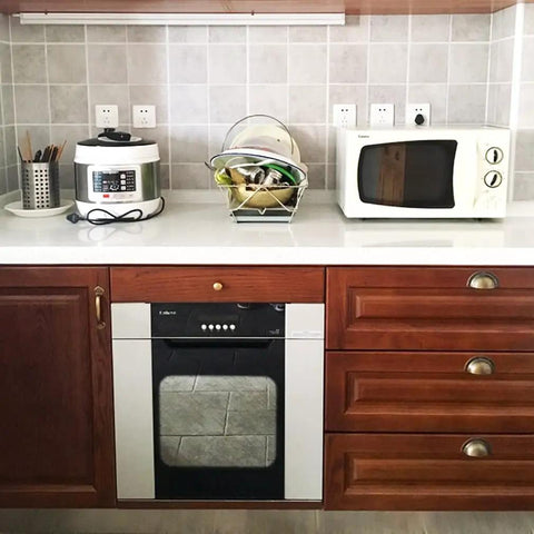 Kitchen setup with wooden cabinets featuring 4 Pack Antique Brass Cup Shell Drawer Pulls For Kitchen Cabinets, Dressers, And Wardrobes.