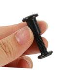Top Shelf Five Piece Pack Of Black Stainless Steel Binding Screws And Nuts For Scrapbooks Photo Albums And Bookbinding With Countersunk Flat Head For No Sweat Setup in hand, showcasing a black binding screw.