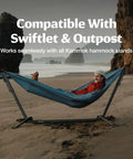Person lounging on Wallaby Lightweight Hammock With Straps Portable Chill Spot For Backyard Park Campus Camping Or Hiking Built For Everyday Use Durable Ripstop Nylon Easy Setup Glacier Blue on beach