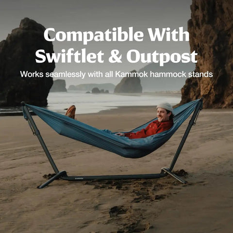 Person lounging on Wallaby Lightweight Hammock With Straps Portable Chill Spot For Backyard Park Campus Camping Or Hiking Built For Everyday Use Durable Ripstop Nylon Easy Setup Glacier Blue on beach