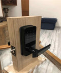 Upgrade Your Pad With This Sleek And Hassle Free Electronic Door Lock A Heavy Duty Keyless Smart Lock That Slaps With App Control For Ultimate Home Security Next Level Apartment Security And Easy Setup For Any Door, showcasing black smart lock on wooden door.