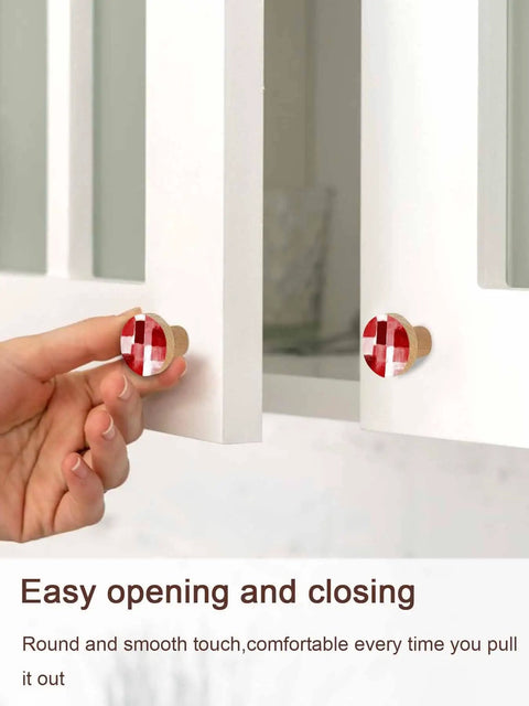 Premium 2 Piece Christmas Cabinet Knobs And Drawer Pulls Featuring A 1.4 Inch Round Design with red abstract finish on drawers.