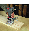 Corded Router With 4.5 Amp Motor And 31,000 RPM, Quarter Inch Laminate Trim, Quick Release Clips, used on wood surface