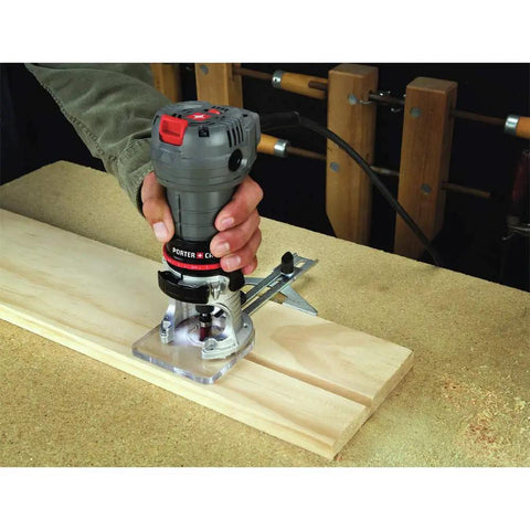 Corded Router With 4.5 Amp Motor And 31,000 RPM, Quarter Inch Laminate Trim, Quick Release Clips, used on wood surface