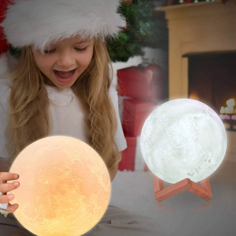 Christmas setting with child holding Moon Lamp 7 Inch 3D Printed Moon Light With Stand, 16 Color LED Night Light at fireplace