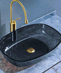 USZWBY Bathroom Vessel Sink, 16 Inch Tempered Glass Gray Wash Basin Bowl, artistic design with brass faucet on countertop.