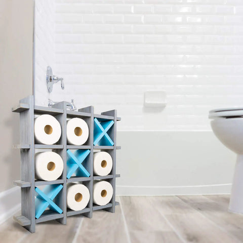 Gray Wooden Toilet Paper Holder With Tic Tac Toe Shelves, freestanding by the wall, holding rolls, in a bathroom.