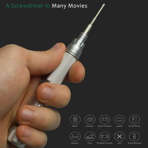 Close-up of a hand holding Compact Precision Screwdriver Set For Electronics 22 In 1 with extendable handle and steel bit.