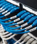 Rock Solid Heavy Duty Heat Shrink Cable Markers 3 Pack on blue Ethernet cables in network rack for identification.