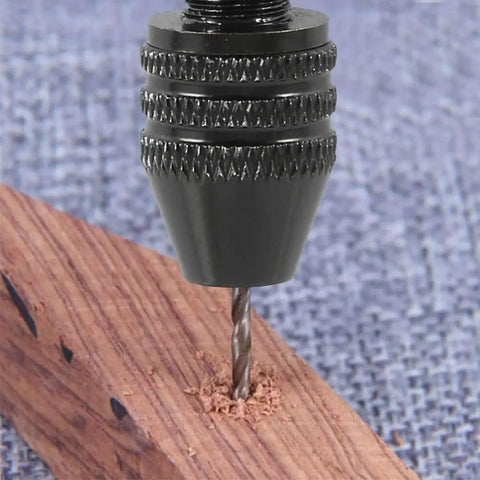 Close-up of a drill bit from the 57Pcs Pin Vise Hand Drill Bits Set for Crafting and DIY Projects drilling into wood surface.