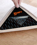 Non Slip Rug Tape Peel And Stick Gripper for Hardwood Concrete and Carpeted Floors secure under rug corner on wooden floor.