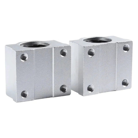 Thinking Process: silver metal ball bearing housing blocks with threaded holes for industrial machinery