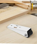 Rock Solid Four Piece Sliding Door Bottom Support Wheels Heavy Duty Rollers with black wheel on a wooden surface for barn door use.