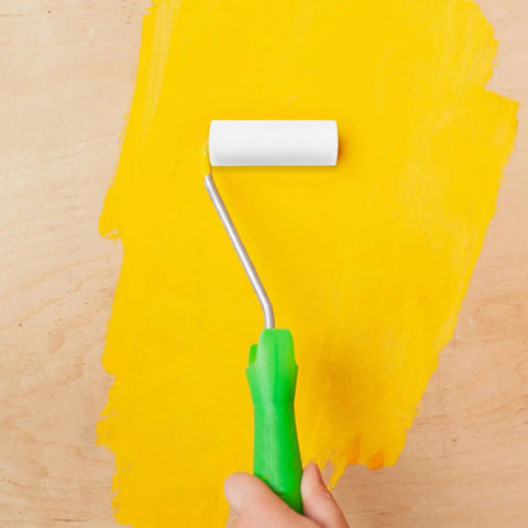 Top Shelf 10 Piece Sponge Paint Rollers For Doors And Window Frames Tailored For Speedy Touch Ups with white foam sleeve on yellow wall.