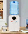 Countertop Water Dispenser With Hot Cold And Room Temperature Settings Desktop Water Cooler For 1 To 5 Gallon Jugs Ideal For Home Office Dorm Your Go To Hydration Station With Easy Pour And Durable White Finish shown on a desk