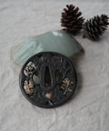 Black Alloy Tsuba Koshirae Accessory With Lotus Pattern for Katana Wakizashi or Tanto, 78mm by 76mm Guard, on fabric