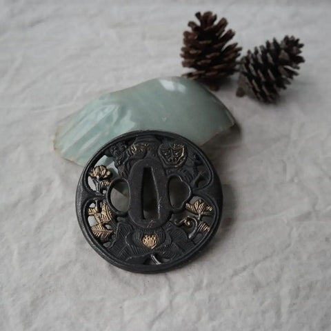 Black Alloy Tsuba Koshirae Accessory With Lotus Pattern for Katana Wakizashi or Tanto, 78mm by 76mm Guard, on fabric