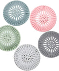 Slick Rubber Drain Stopper And Hair Catcher For Showers, Baths, And Kitchen Sinks, 5 colorful rubber strainers on white background.