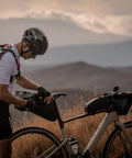 Handlebar Bag For Bicycles Waterproof Front Frame Storage Pouch 3.5L used on a bicycle by a cyclist in outdoor setting