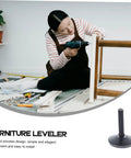 Person using a power drill to install Heavy Duty Adjustable Furniture Levelers With Swivel Base For Tables And Cabinets.