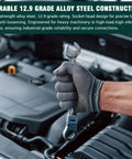 Mechanic using a wrench on an engine, highlighting the durability of 12.9 grade alloy steel construction for industrial applications.