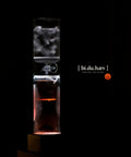 Premium Cold Brew Coffee Maker System Hits Different With Smooth Zero Bitter Hit Cold Drip Tap For Iced Coffee Tea Wine And Sake Featuring Award Winning Design Perfect For Home Bars And Weekend Kickbacks, showcasing a clear glass coffee dripper.