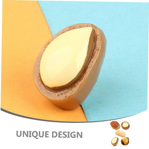 Close-up of a realistic miniature nut model from 20 Pieces Miniature Nut Models For Dollhouse Decor And Resin Crafts Realistic Tiny Food Props.