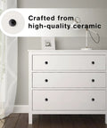 White dresser with Handmade Spade Black And White Ceramic Cabinet Knobs Set Of 6 enhancing a modern room decor.
