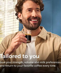 Man enjoying a coffee in a glass, smiling, showcasing a tailored coffee experience with the Fully Automatic Espresso Machine.