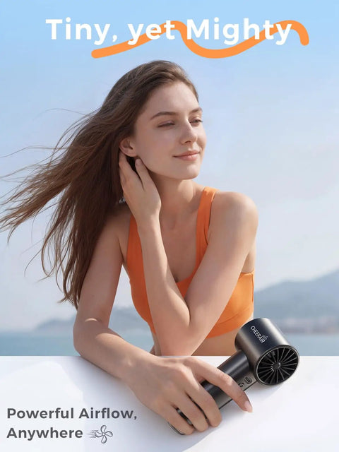 Person holding a Handheld Portable Fan With 6 Speeds, Tiny But Mighty Mini Personal Fan, 5000mAh Rechargeable Battery outdoors.