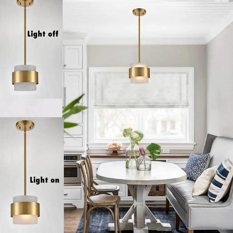 Gold Pendant Light Fixture With Frosted Glass Shade for kitchen island and dining room modern rod hanging lamp in room setting.