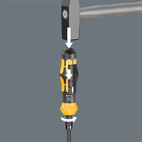 Compact Impact Screwdriver Set 19-Piece Heavy Duty Beast Kit With Manual Impact Wrench Converts Hammer Blows To 25 Nm Loosening Torque Tackling Stubborn Screws Black Yellow Design Includes Precision Bits And Easy Grip shown in action by a hammer hitting the handle.