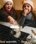 Turkish Warmer Coffee Pot 24 Ounce Stainless Steel 18 8 Professional Quality For Stovetop Turkish Coffee Cappuccinos Lattes Milk Warming And Butter Melting on stove with children in background.