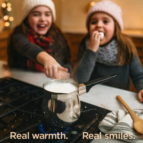 Turkish Warmer Coffee Pot 24 Ounce Stainless Steel 18 8 Professional Quality For Stovetop Turkish Coffee Cappuccinos Lattes Milk Warming And Butter Melting on stove with children in background.