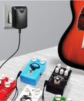 9V DC 1A Power Supply Adapter For Guitar Effects Pedals Center Negative Tip with connected colorful guitar pedals