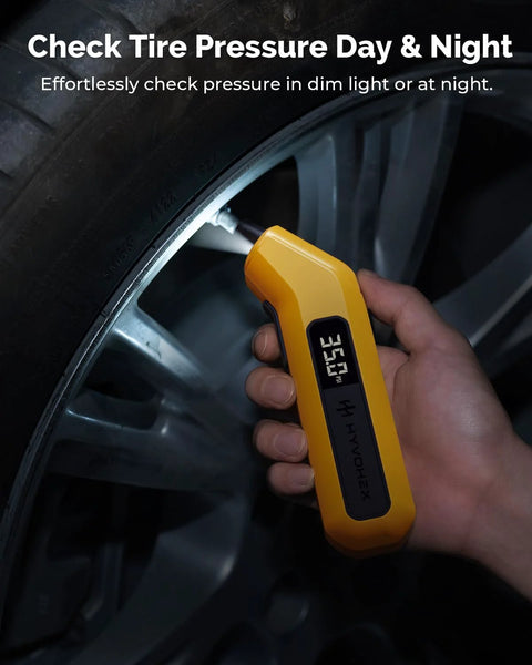 HYVOHEX digital tire pressure gauge, yellow with LED display, front view used on car tire valve