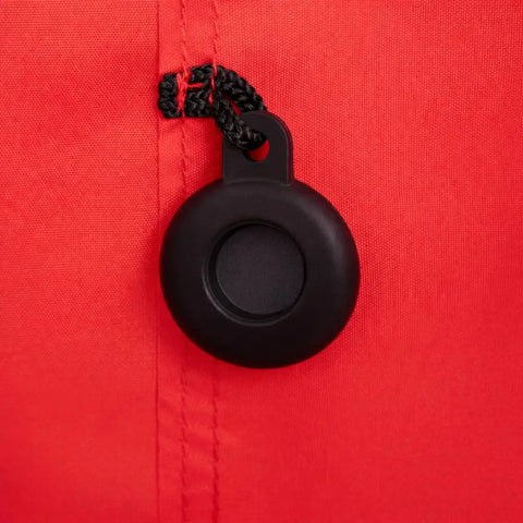 Close-up of AirTag holder on red Gate Check Travel Bag For Compact Fold Strollers With Built In AirTag Holder Red Protects Your Stroller