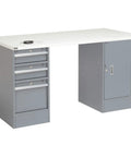 Heavy Hitter Steel Pedestal Workbench With Three Slick Locking Drawers And One Tight Storage Cabinet In Sleek Gray Finish close-up view with white work surface.