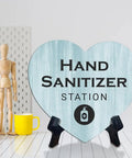 Heart Shape Hand Sanitizer Station Sign With Sturdy Black Easel Stand 6X5 Inch Wood Finish Tabletop Counter Decor For Beauty Salon Retail Shop Or Home Office Keep Your Setup Fresh And Looking Dope Day One, displayed on a table.